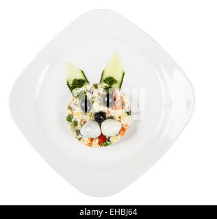 Restourant serving dish for child`s menu - salad with rabbit face Stock Photo